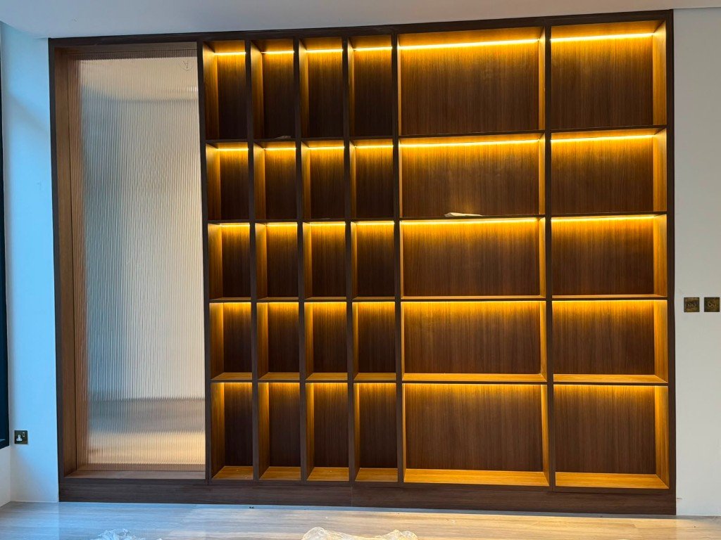 Custom lit timber shelving by ACC